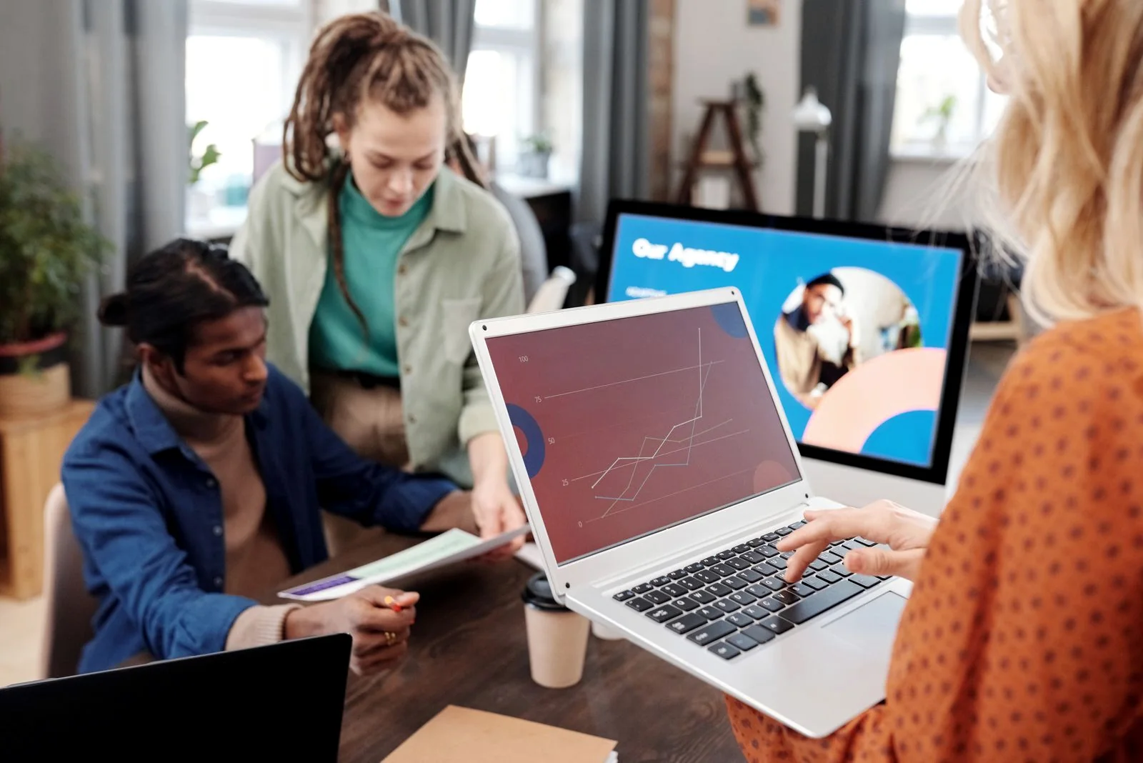 Marketing team reviewing digital performance charts
