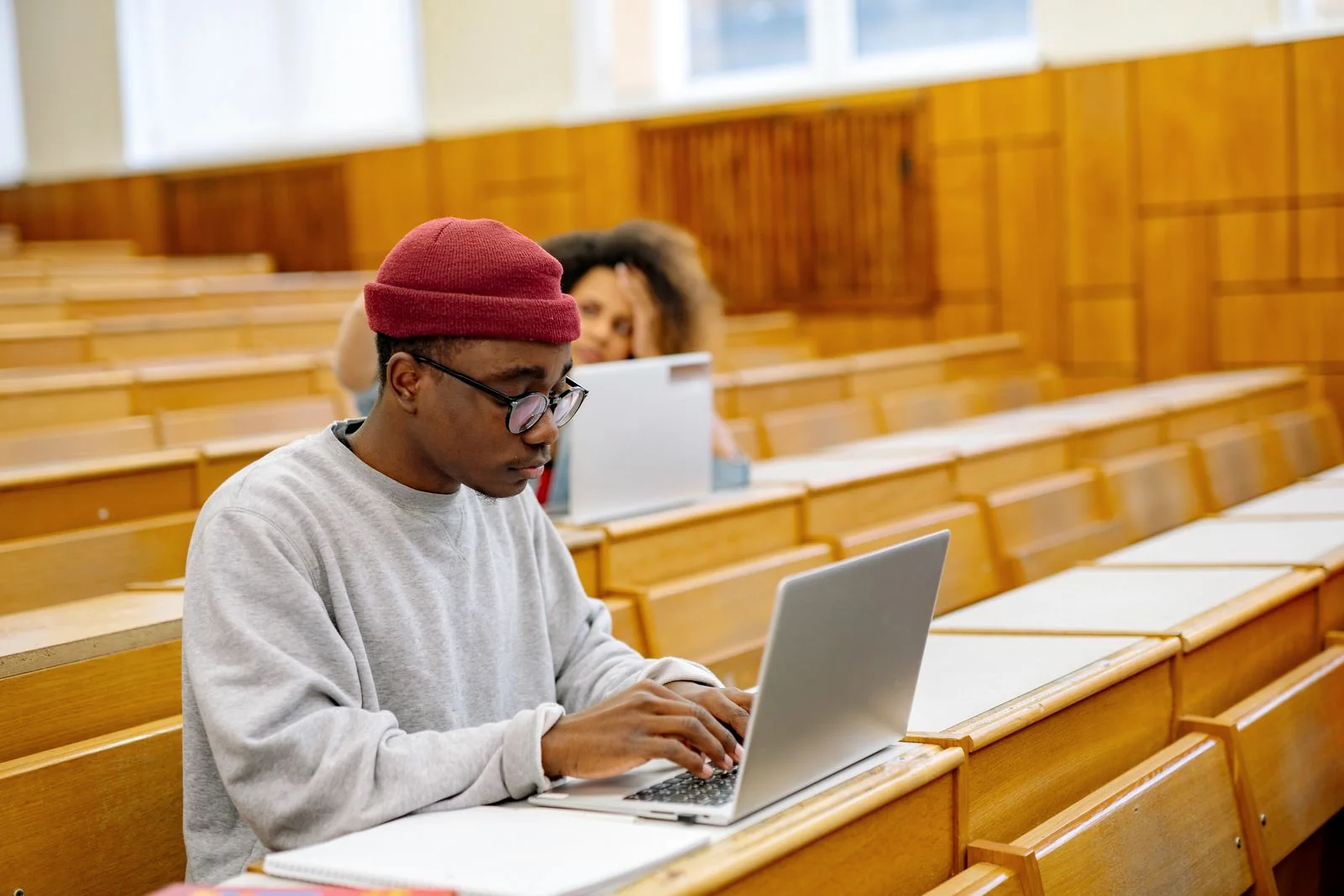 University student using a laptop in a modern learning environment